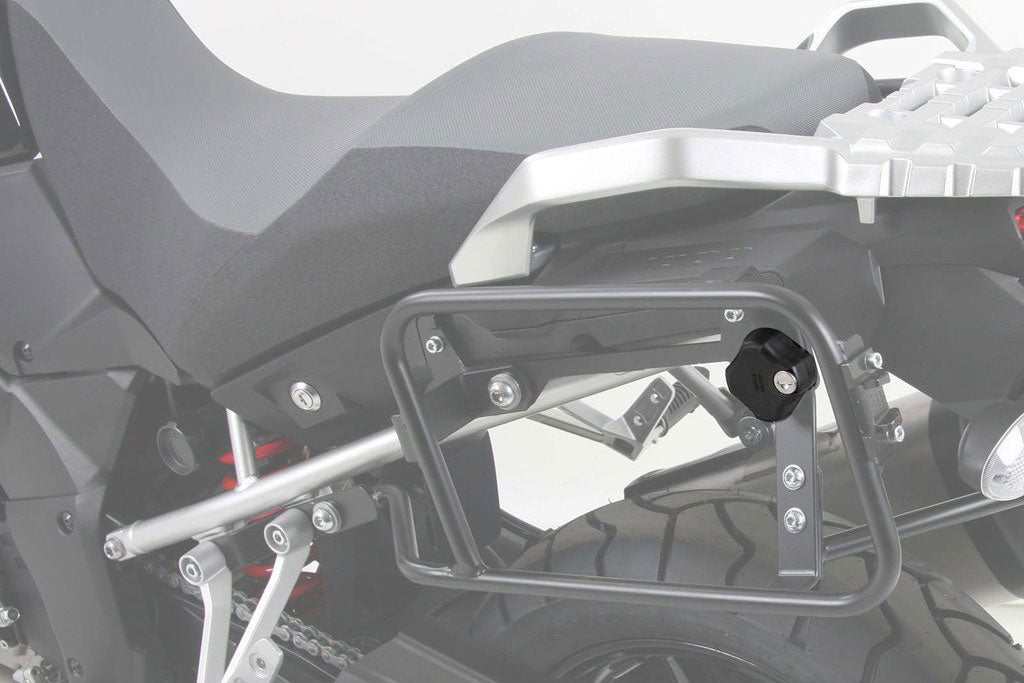 Lockable sidecase screw on a motorcycle side carrier with anti-theft securing mechanism by Hepco Becker.