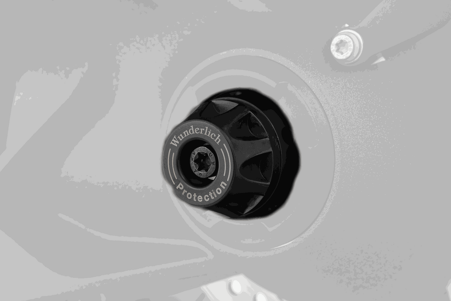 BMW R Series Protection axle slider with DoubleShock pad for impact and sliding damage prevention.