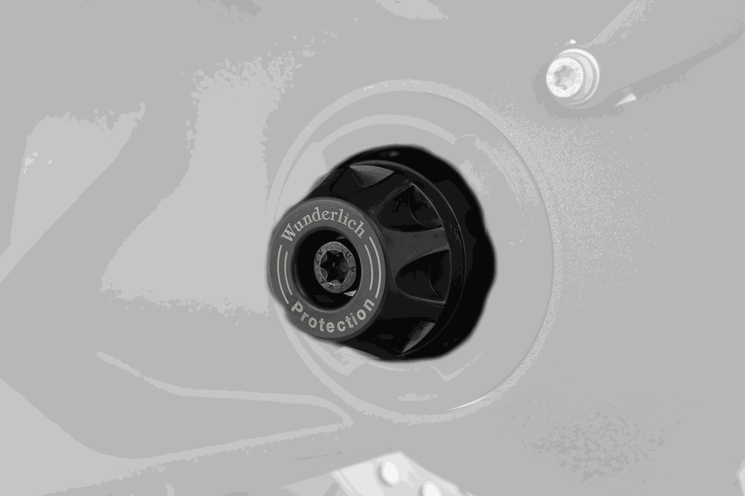 BMW R Series Protection axle slider with DoubleShock pad for impact and sliding damage prevention.