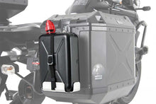 Fuel container 2L with mounting bracket on motorcycle.