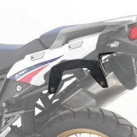 Honda Africa Twin C-Bow sidecase carrier mounted on motorcycle.