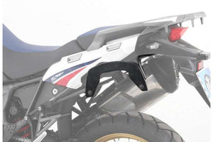 Honda Africa Twin C-Bow sidecase carrier mounted on motorcycle.