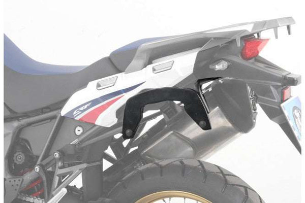 Honda Africa Twin C-Bow sidecase carrier mounted on motorcycle.