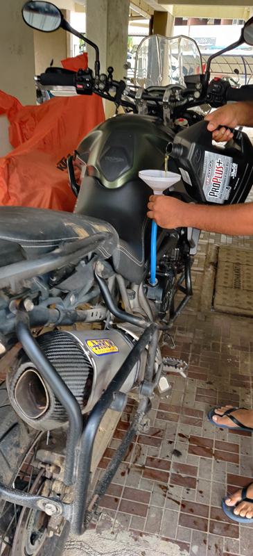 oil changing on a motorcycle
