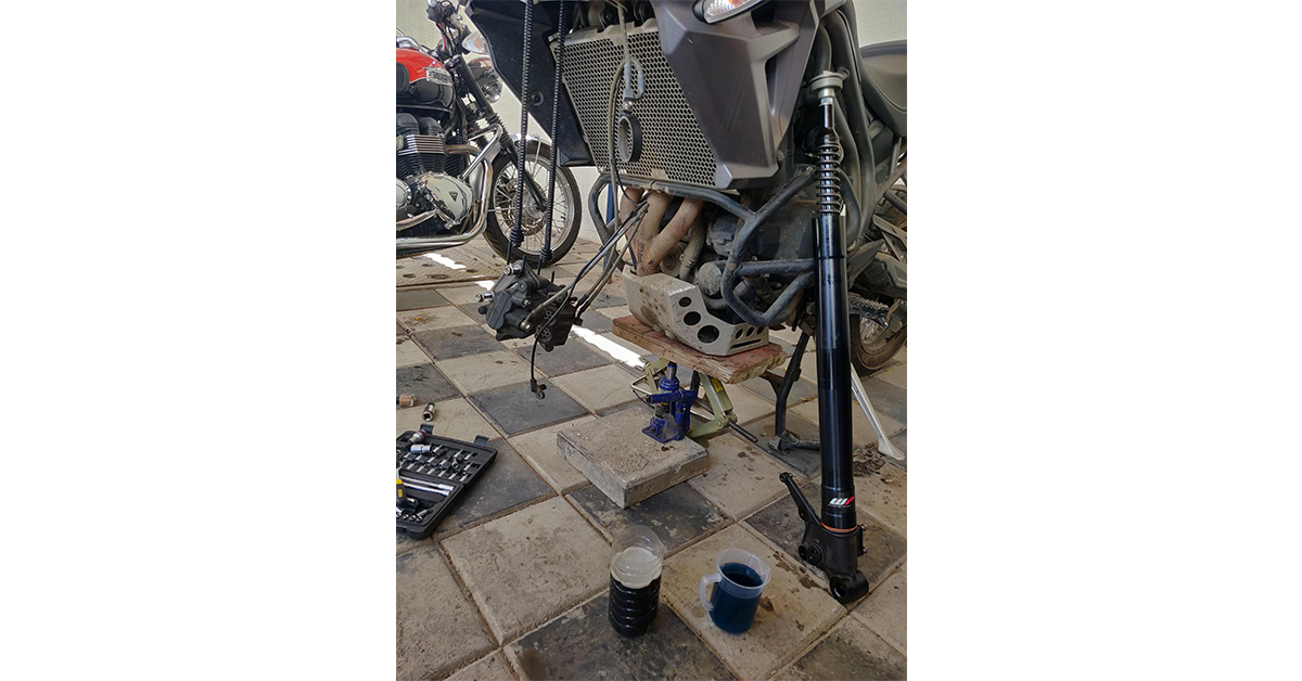 Front forks of a bike getting serviced.